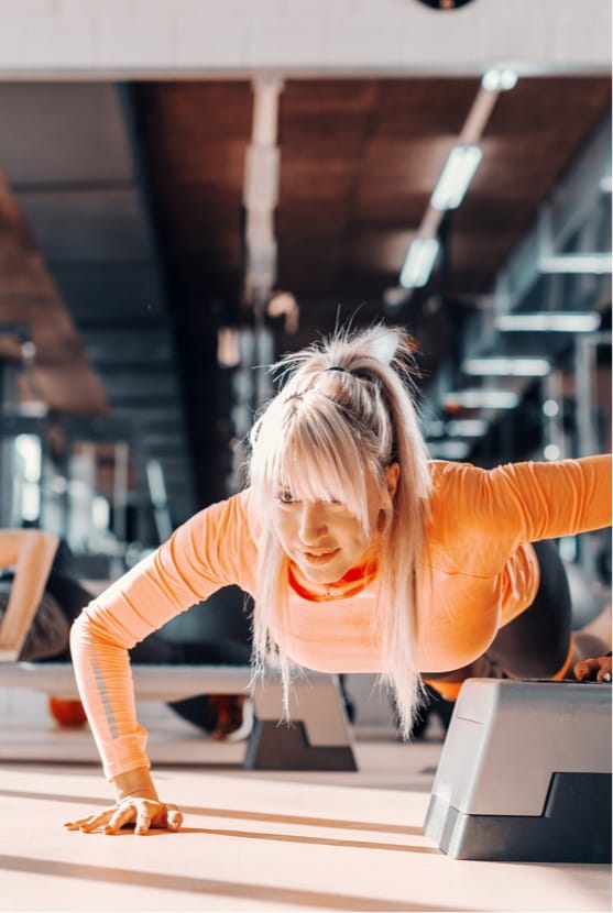 Woman doing pushups in a gym