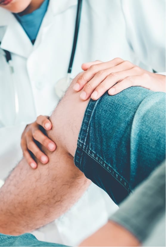 Doctor looking at patient's knee