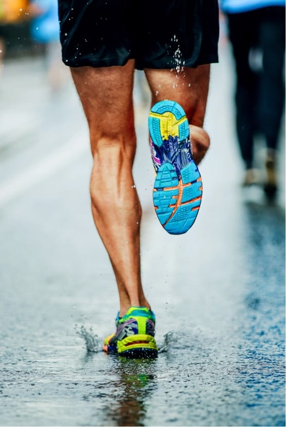 Close up of men's calves, running